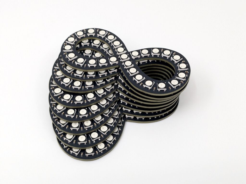 A stack of finished NeoInfinity badges